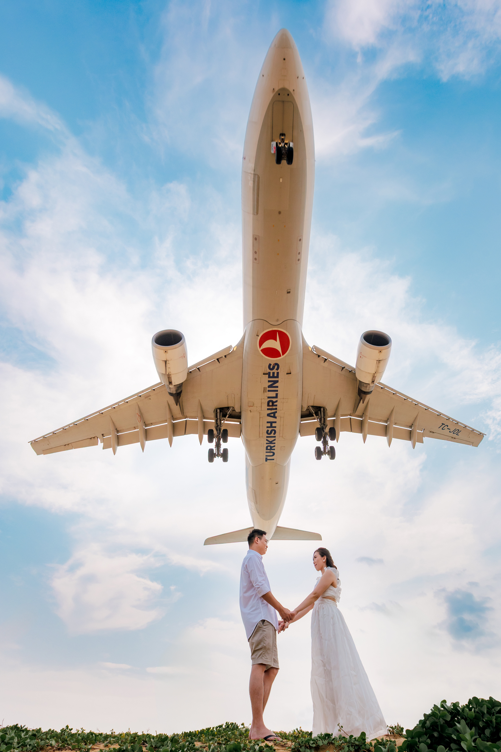 couple photoshoot with airplane at Mai khao beach 