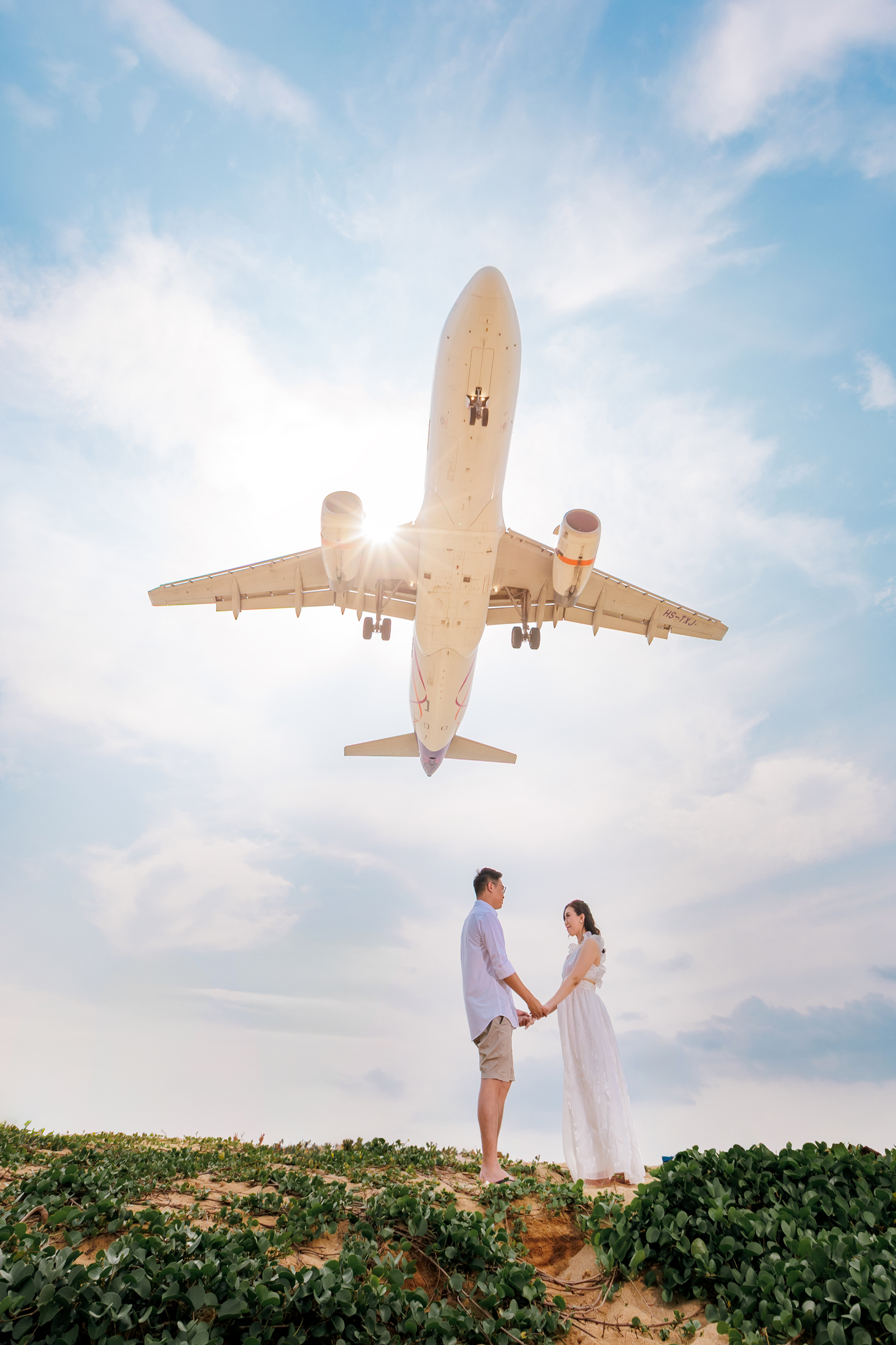 couple photoshoot with airplane at Mai khao beach 