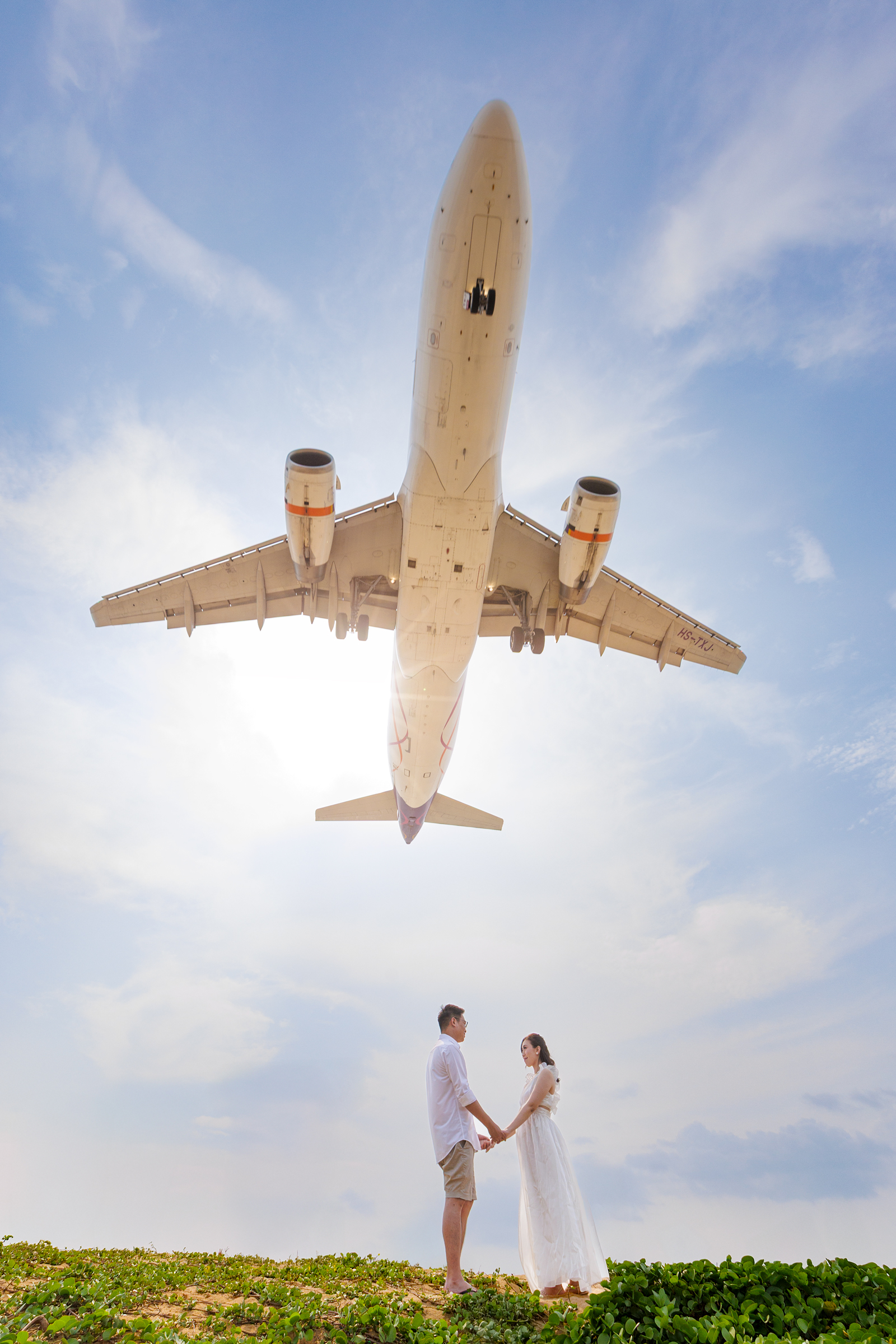 couple photoshoot with airplane at Mai khao beach 