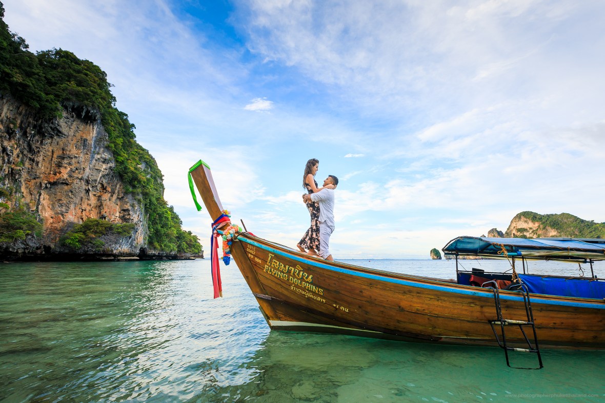 Marriage proposal photoshoot on long tail boat at monkey beach Phi Phi island Krabi Thailand