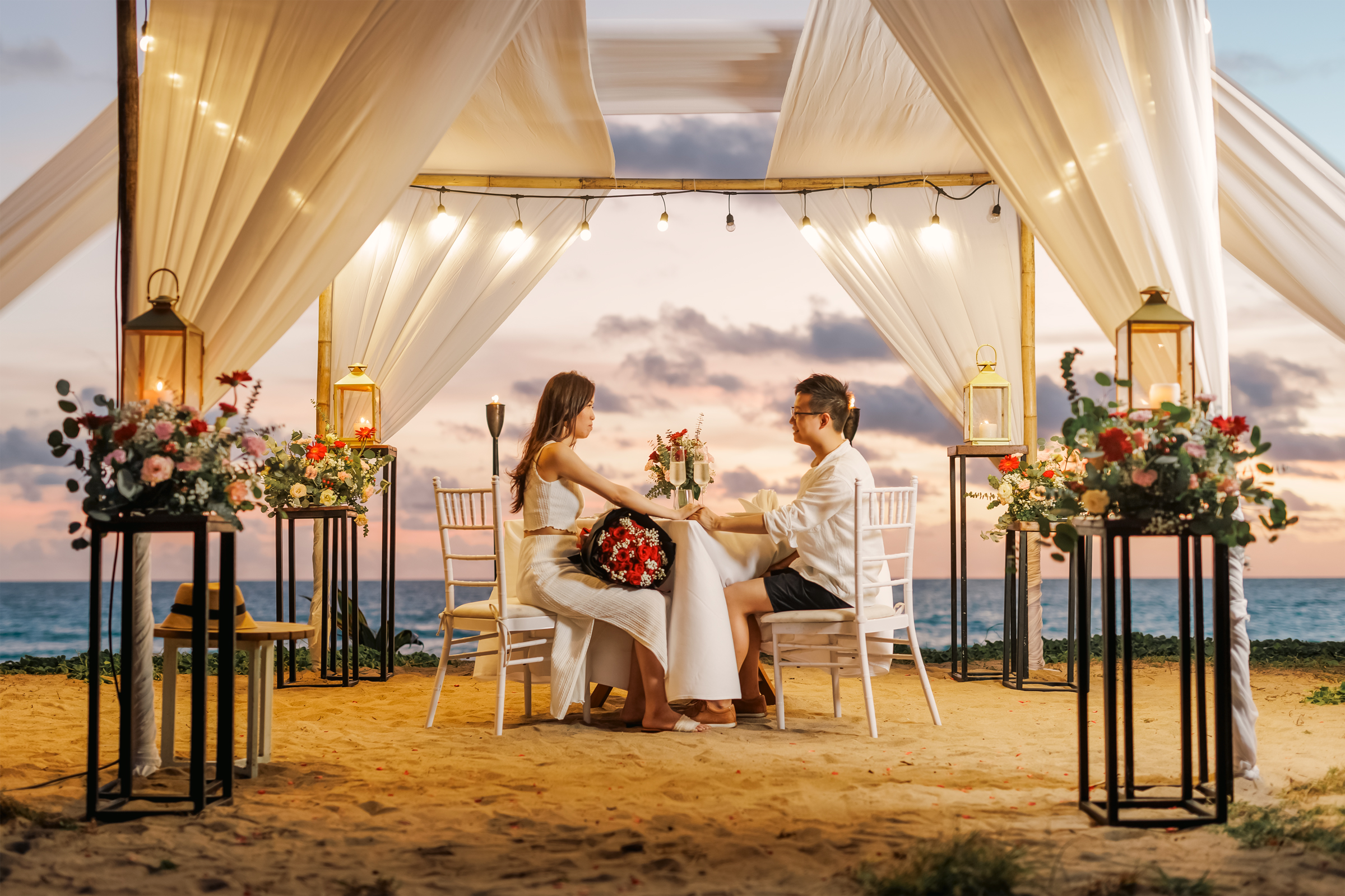 private romantic sunset dinner by the beach at mai khao beach phuket