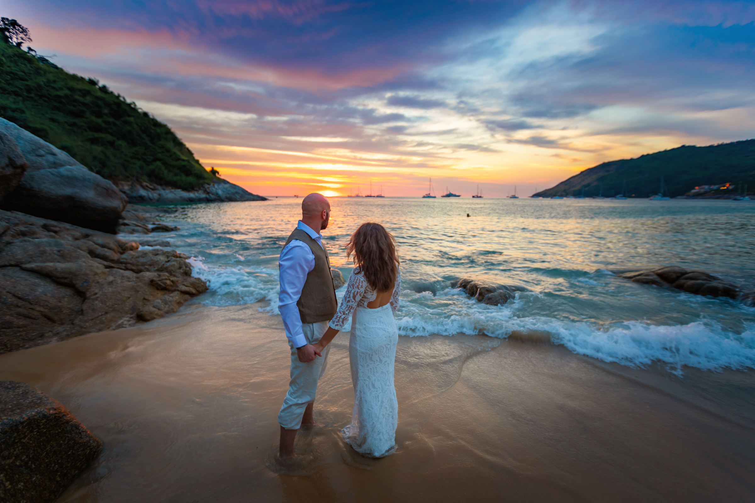 wedding photoshoot as sunset at nai harn beach phuket
