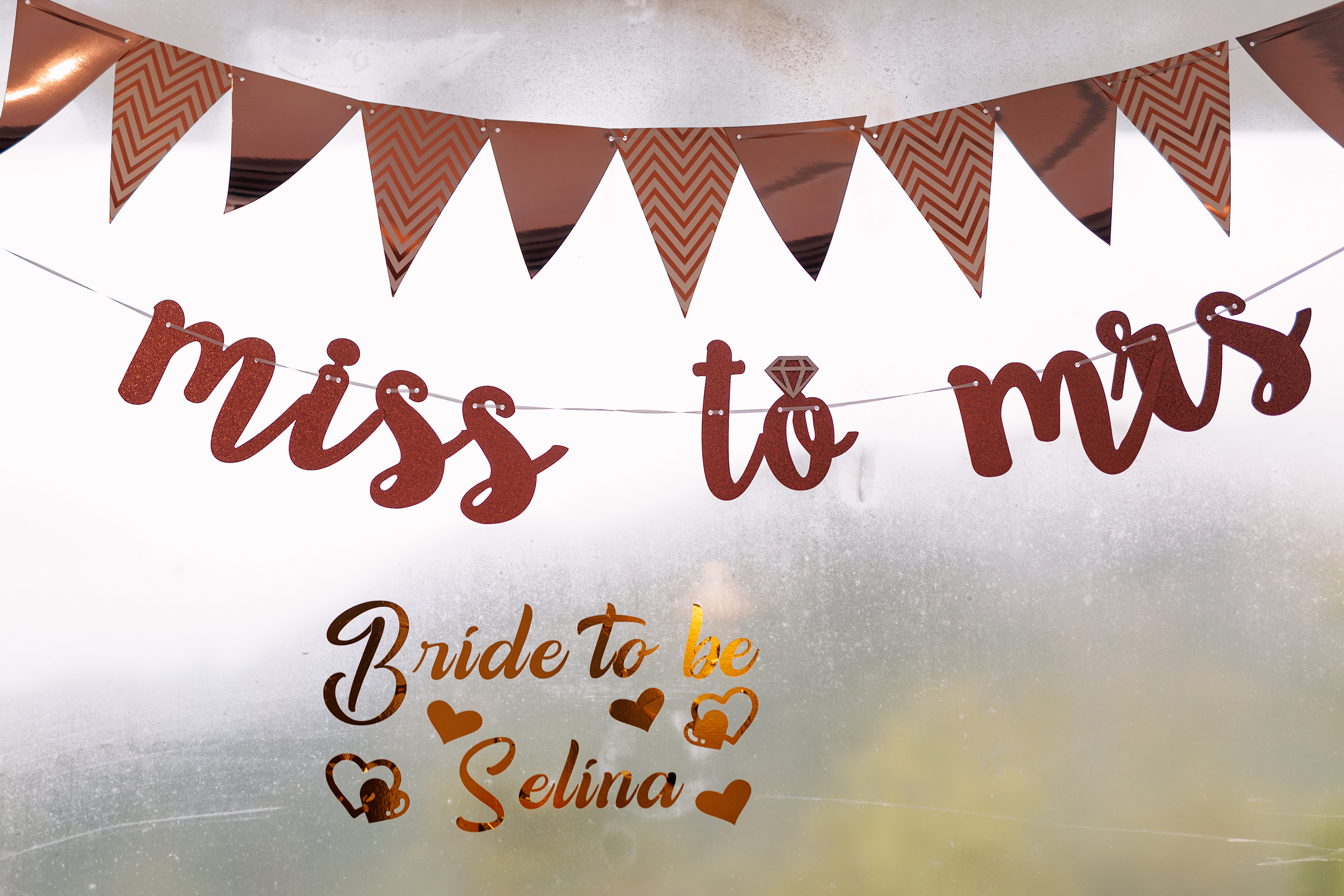 Bachelor party photoshoot  A decorative banner that reads 'miss to mrs' in glittery red letters, accompanied by a diamond graphic, with text below stating 'Bride to be Selina' in a cursive font.