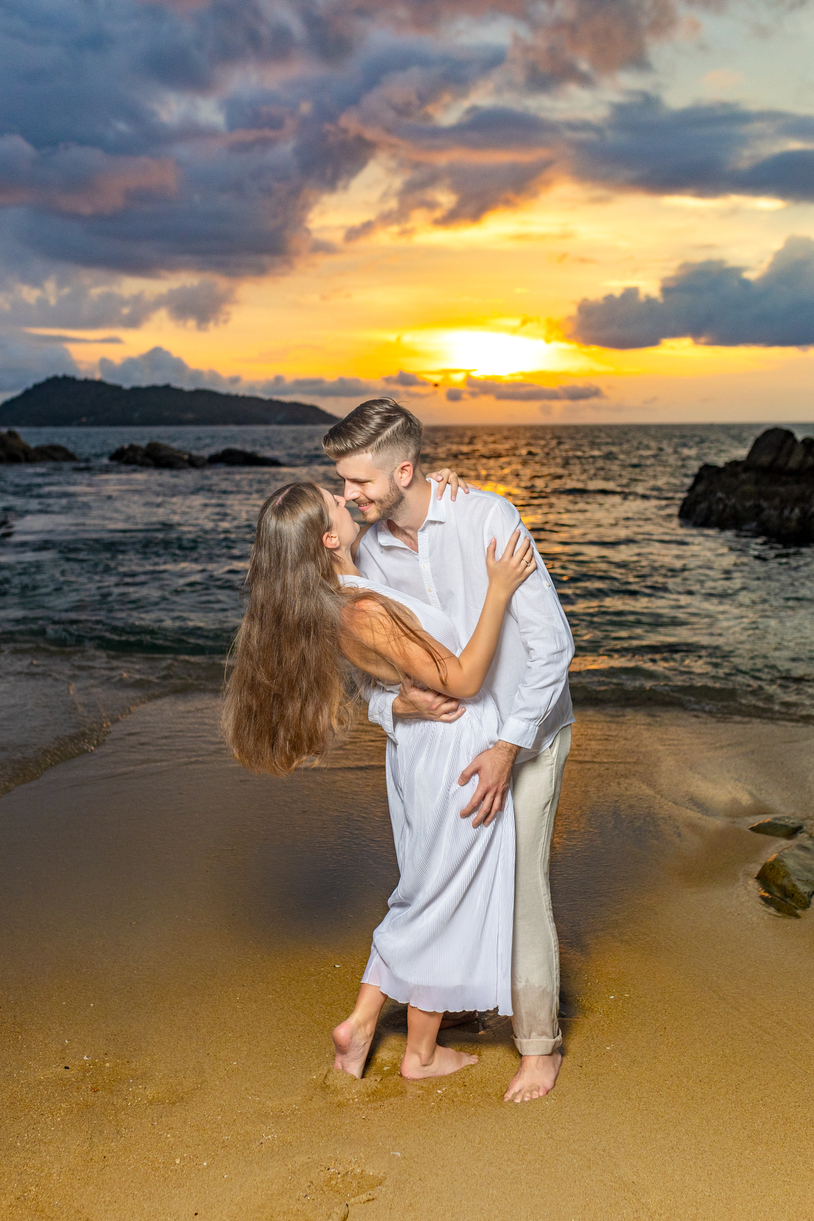 Engagement photoshoot as sunset time at kalim beach phuket
