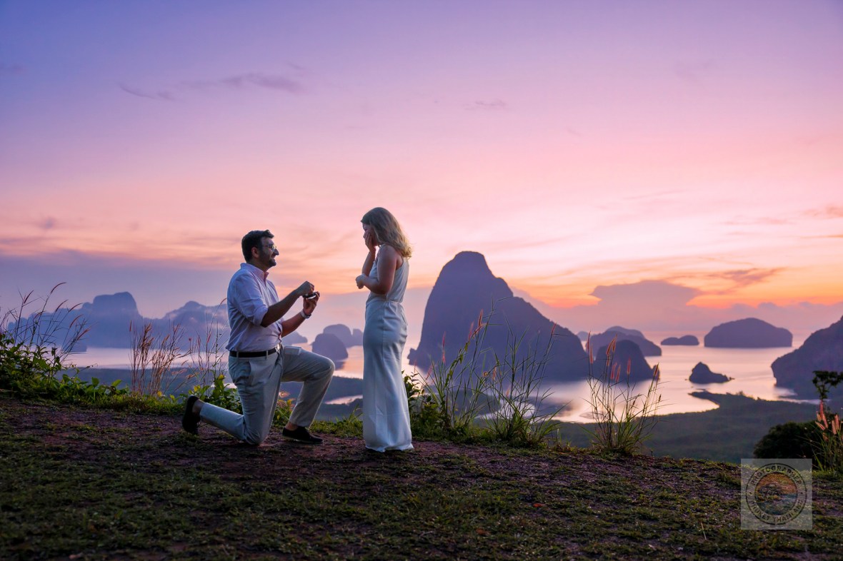 Couple engaged in a marriage proposal at Samet Nangshe viewpoint during sunrise, with beautiful limestone formations in the background.