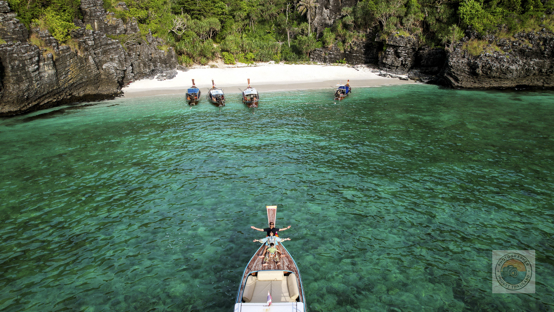 family photography on long tail boat by drone at nui bay phi phi island krabi