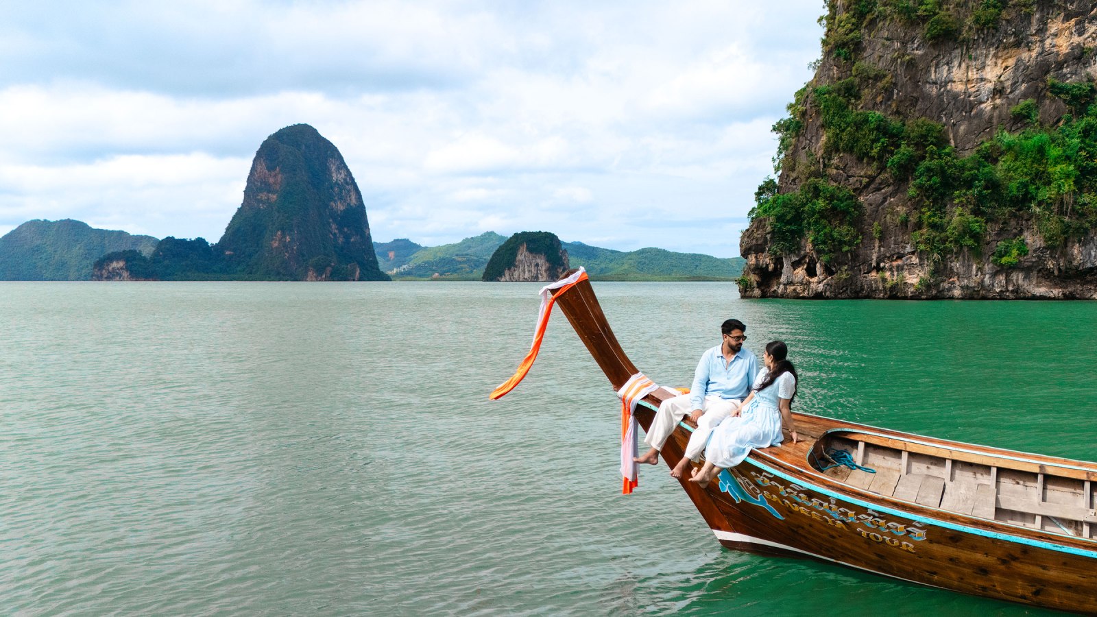 couple photography on long tail boat by drone at phang nga bay